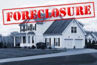 House with foreclosure title stamped on top
